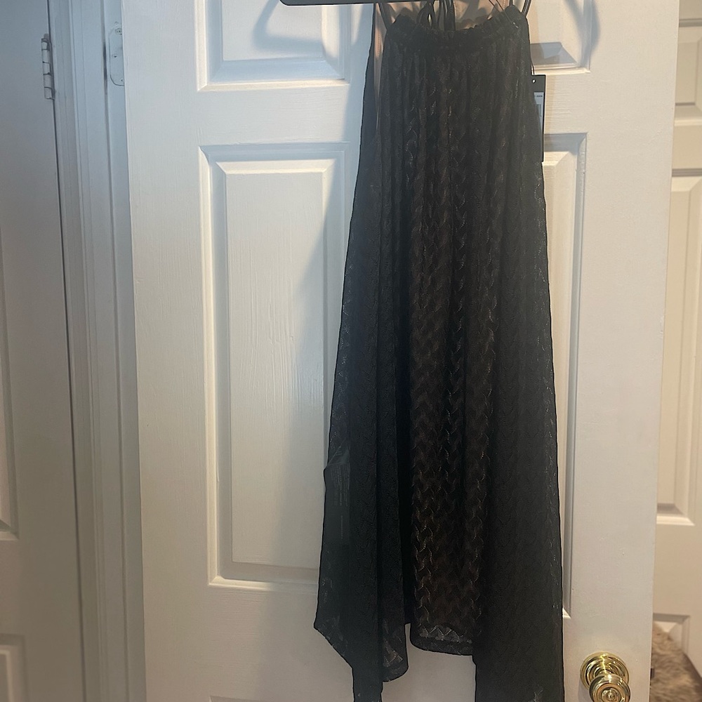 BCBG Spaghetti Strap lace fully lined dress
Asymmetric handkerchief hem